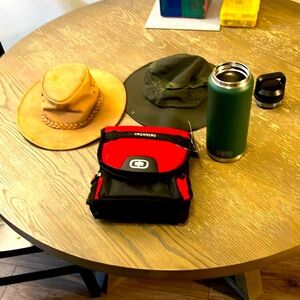 32 ounce Yeti tumbler/ new ogio lunch box/ leather kakadu and sun bucket hat.